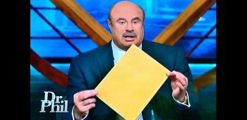Dr. Phil McGraw opens folder containing autopsy report.