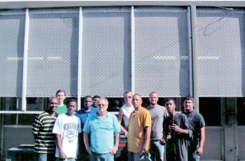 Students at S. LA TH Harris Campus install new air conditioner unit