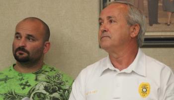 Raymond Mott, at left, with Eunice Police Chief Ronald Dies before the city council on Tuesday.