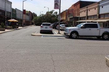 Vehicles parking in blue painted spots are violating no restrictions.